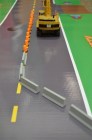 Starter kit
Highway Work Zones and Signs, Signals, and Barricades
6' road way x 2' wide, 30 drums, 30 concrete barricades, 10 signs, storage bag, dry erase marker. Scale toys Not In Kit